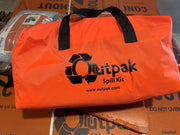 Orange Outpak Spill Kit bag on a cardboard surface