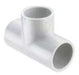 A white PVC tee fitting with a visible hollow center for pipe connection.