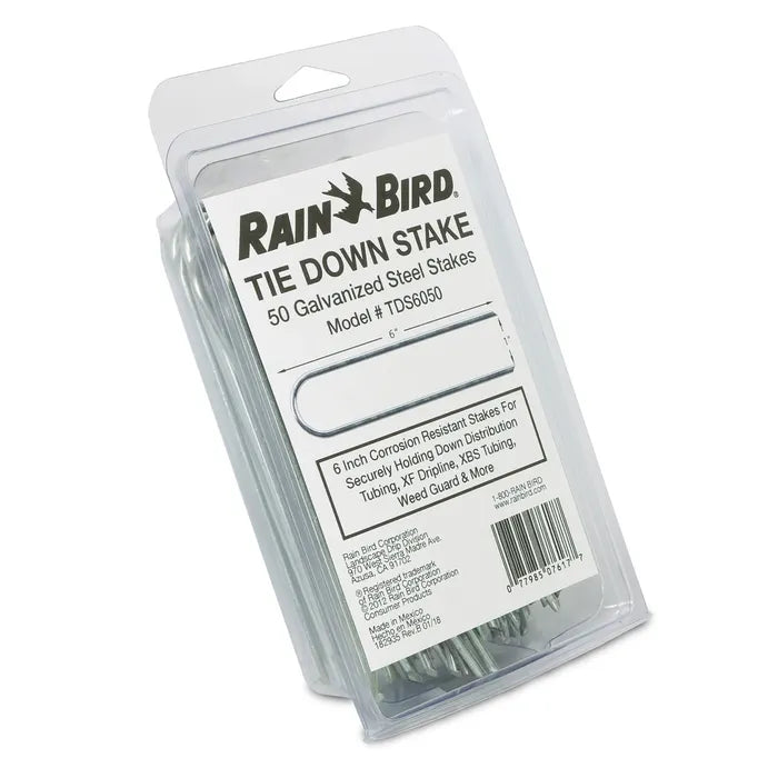 Rain Bird Tie Down Stake package containing 50 galvanized steel stakes, shown in clear plastic packaging with a white label.